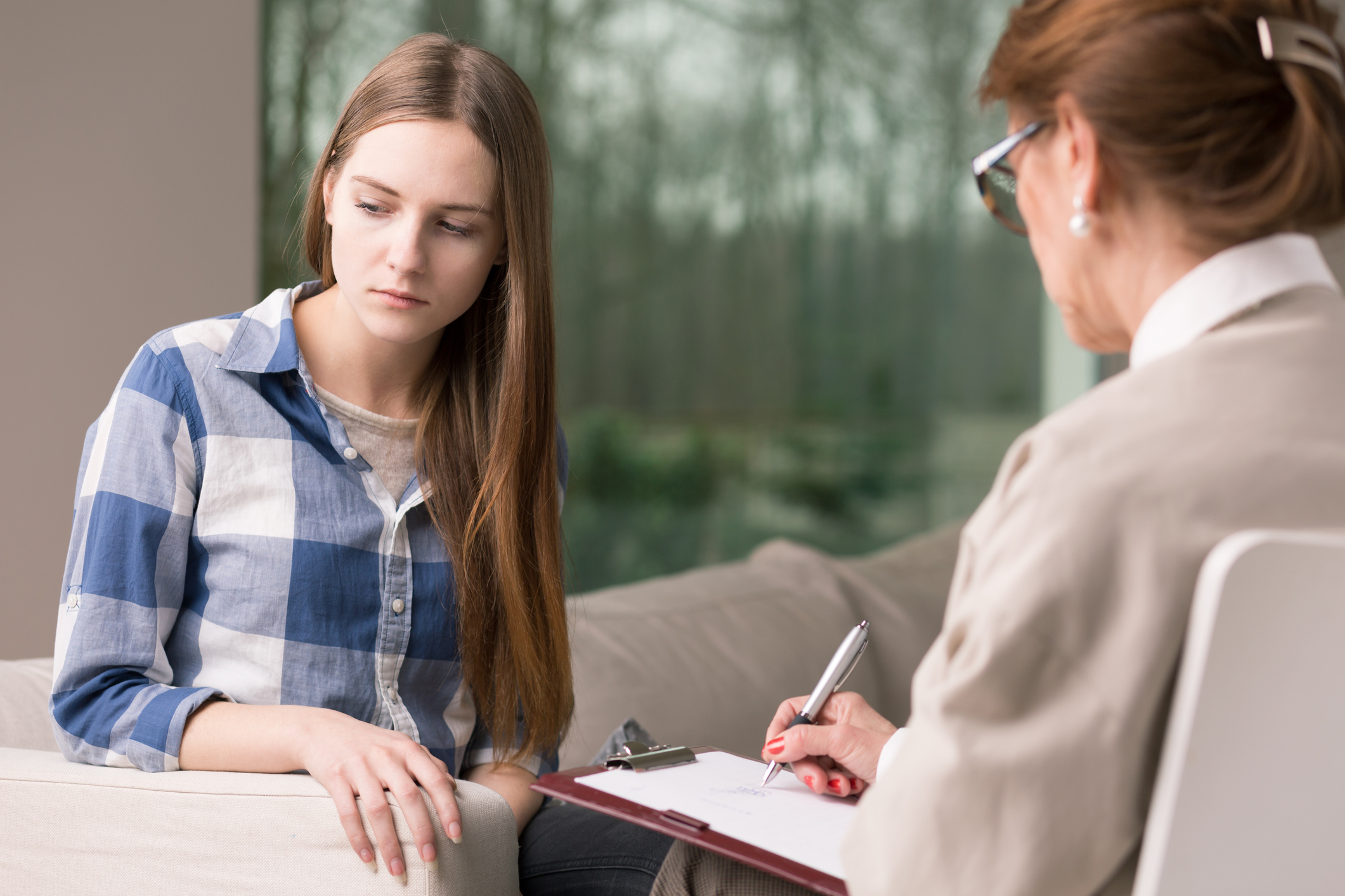 Teenager with depression and experienced psychotherapist